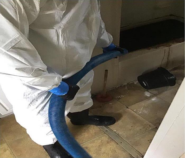 technician extracted sewage from bathroom