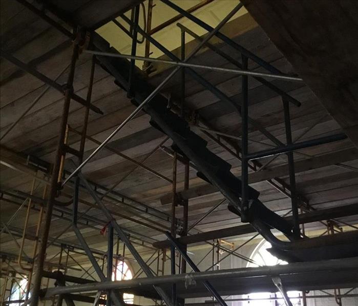 Scaffolding under the ceiling with exposed framework