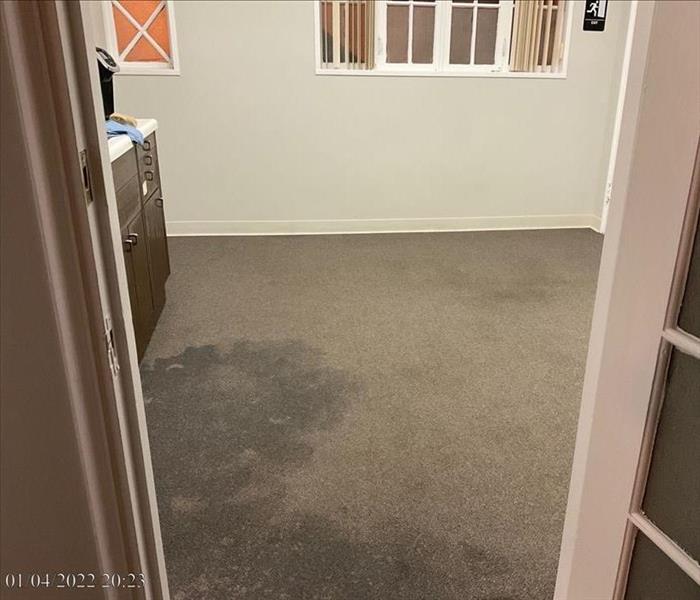 Water saturation on break room carpeting with most contents removed
